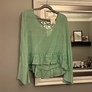 Never been worn, mint green, bell sleeved, shirt size L